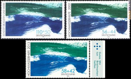 La carta valore originale, risalente al 1998, per la protezione dell’ambiente e le due versioni pro inondati del 2002 e 2013